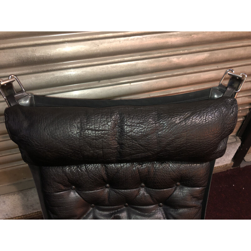 Pair of vintage black Falcon armchairs with ottoman