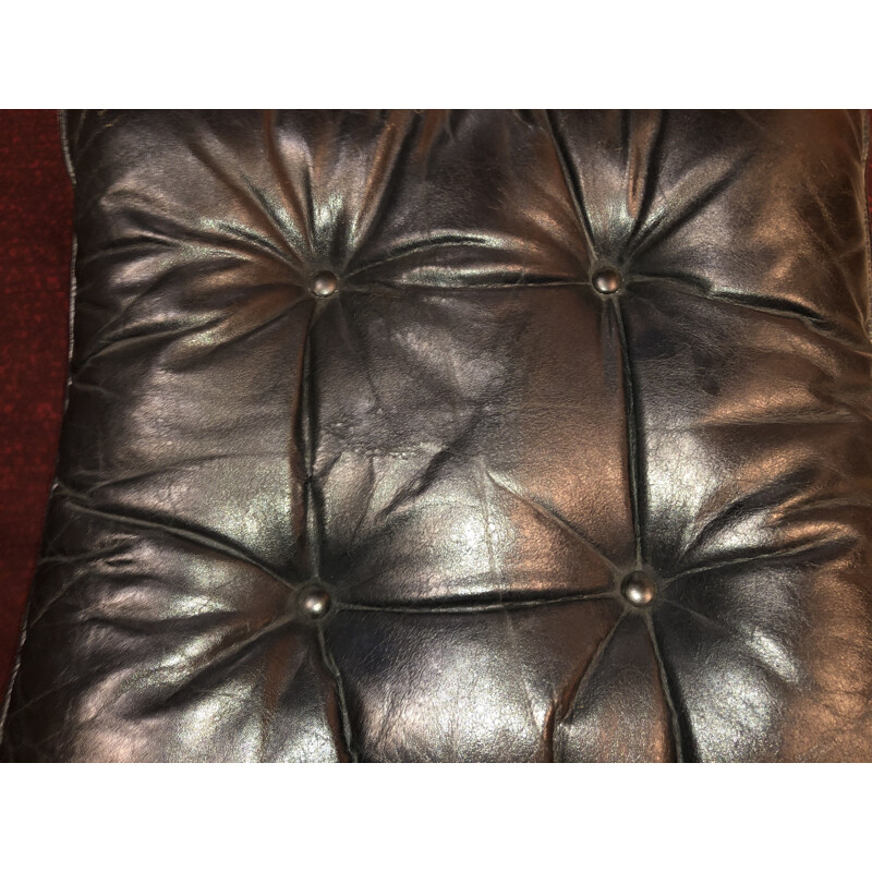 Pair of vintage black Falcon armchairs with ottoman