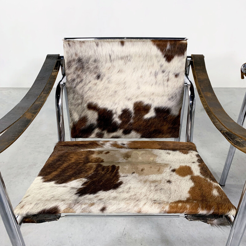 Pair of vintage Cow Hide Armchairs by Le Corbusier for Cassina 1970s