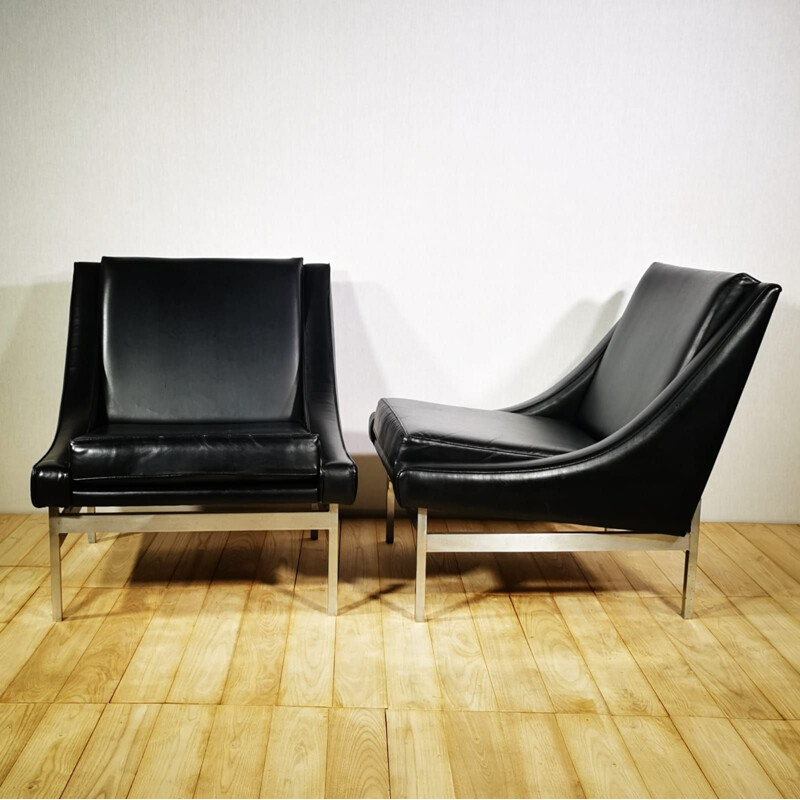 Pair of vintage low armchairs in black leather and chromed metal 1970