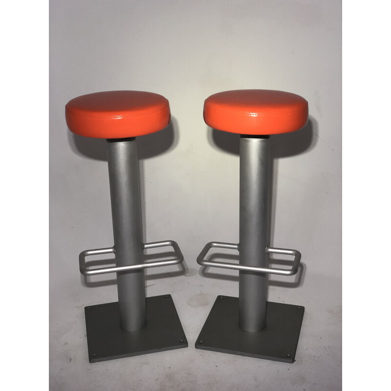Pair of vintage bar stools in orange leatherette