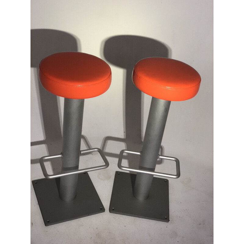 Pair of vintage bar stools in orange leatherette