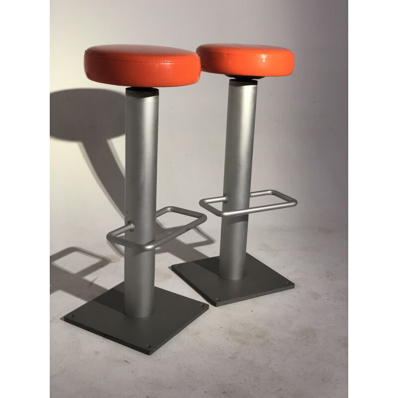 Pair of vintage bar stools in orange leatherette