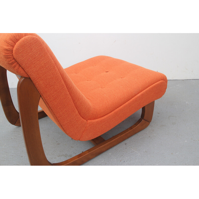 Lounge chair in solid wood and orange fabric - 1970s