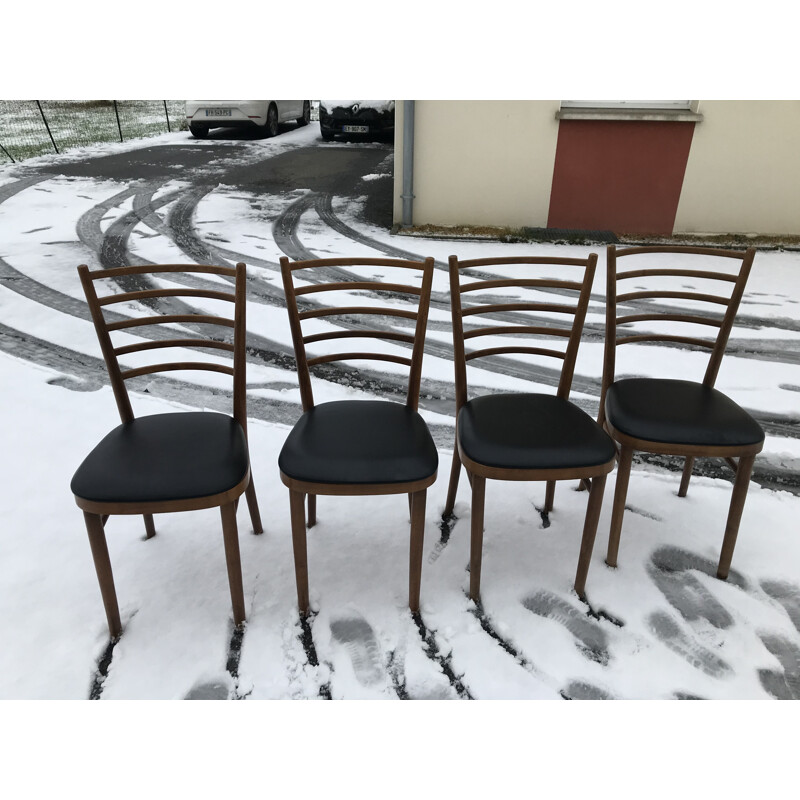 Set of 4 vintage chairs with wooden bars and skai 1960s
