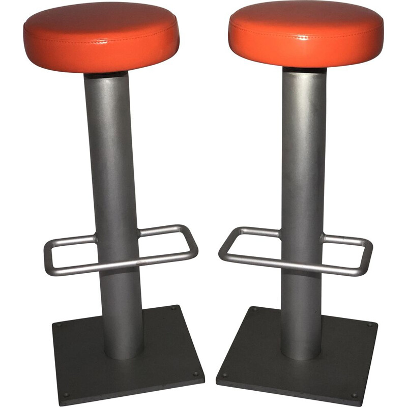 Pair of vintage bar stools in orange leatherette