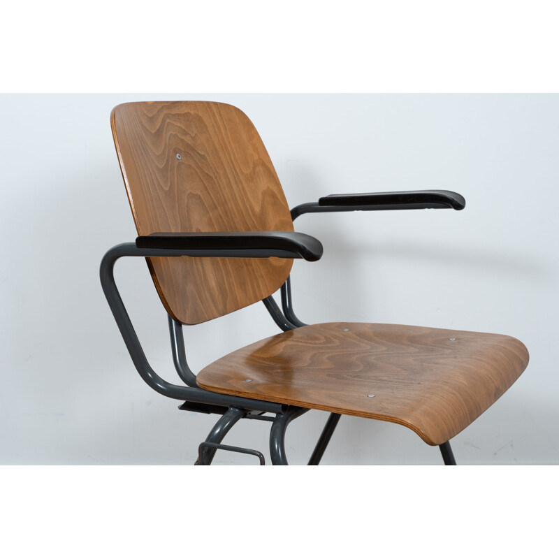 Vintage Stackable industrial chair with armrests by Kho Liang Ie