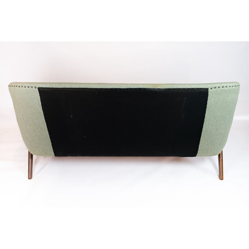 Vintage seater sofa with light green striped fabric and teak legs and arms Denmark 1960s