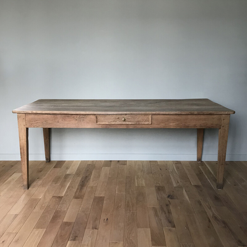 Vintage table with sleek lines and elegant oak legs