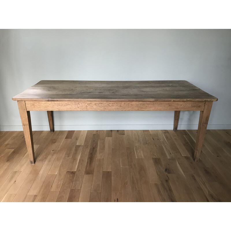 Vintage table with sleek lines and elegant oak legs