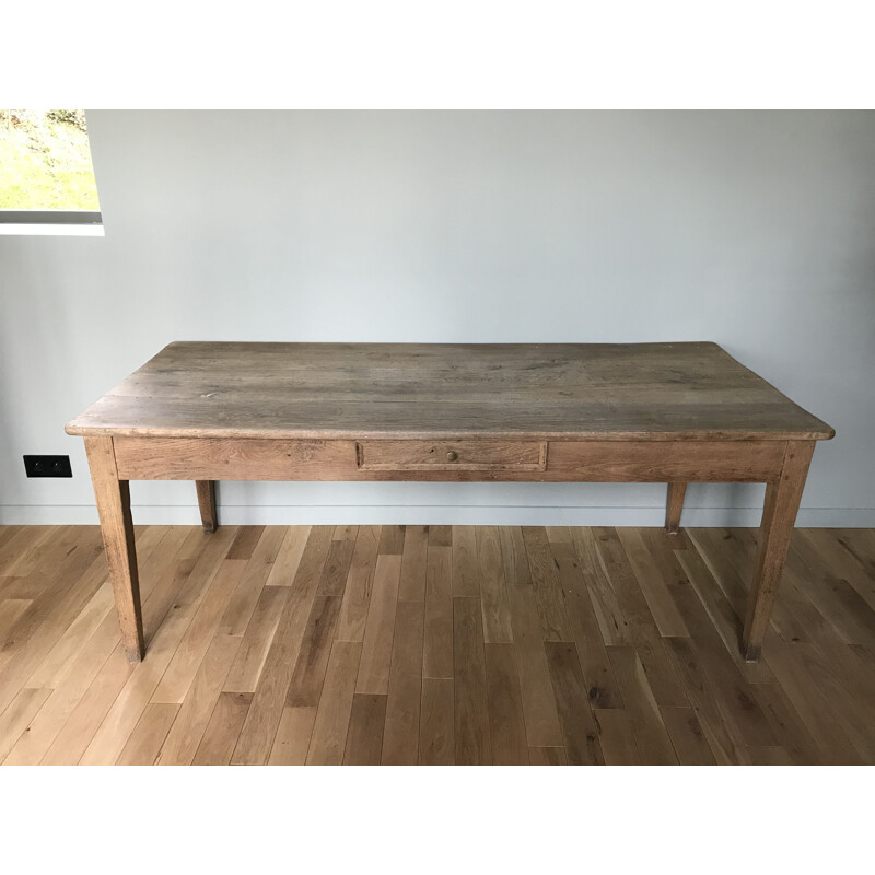 Vintage table with sleek lines and elegant oak legs