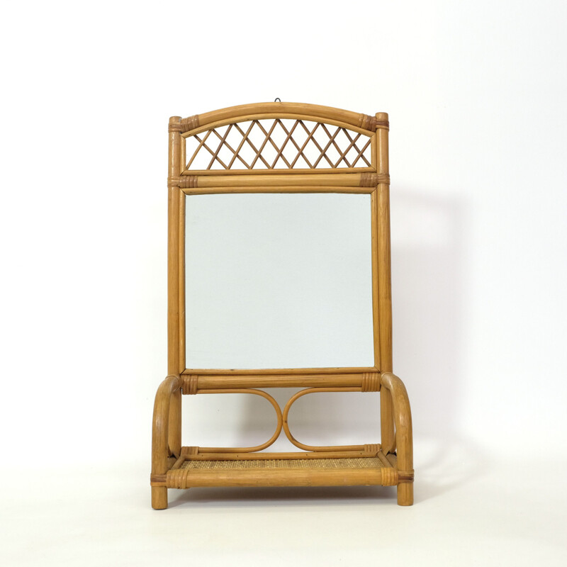 Vintage mirror and its rattan shelf 1970s