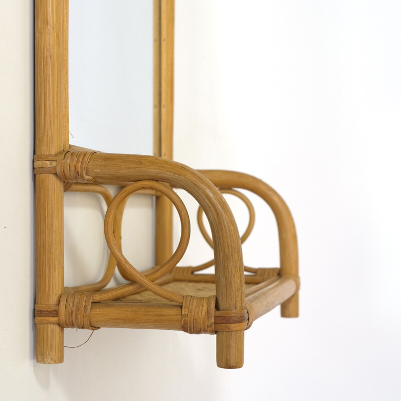 Vintage mirror and its rattan shelf 1970s