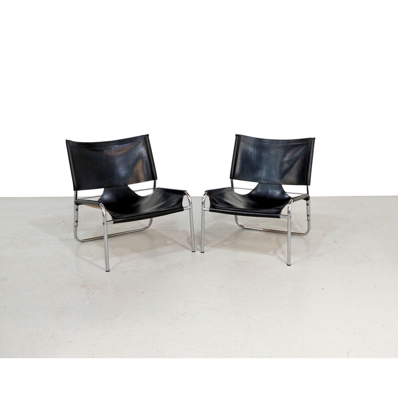 Pair of Mid-century easy chairs in black leather and chrome 1970s