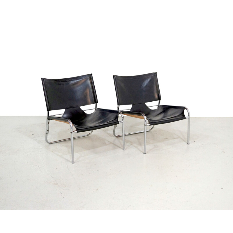 Pair of Mid-century easy chairs in black leather and chrome 1970s