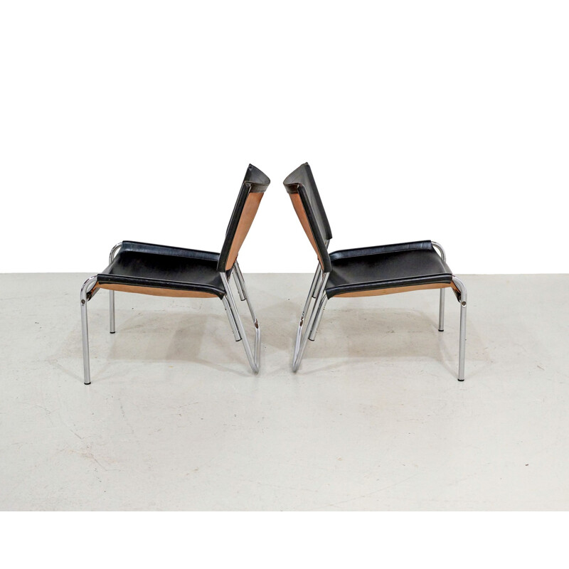 Pair of Mid-century easy chairs in black leather and chrome 1970s