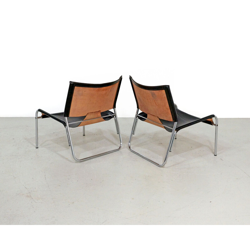 Pair of Mid-century easy chairs in black leather and chrome 1970s