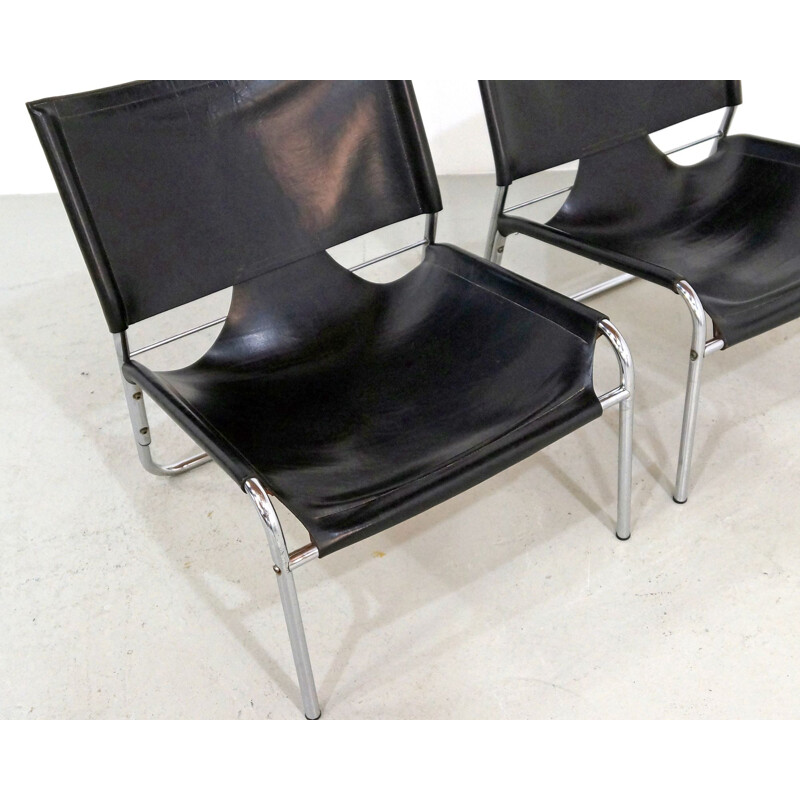 Pair of Mid-century easy chairs in black leather and chrome 1970s