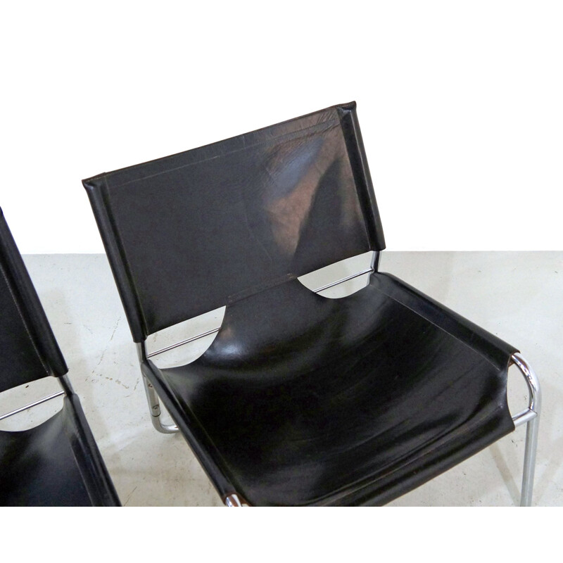 Pair of Mid-century easy chairs in black leather and chrome 1970s