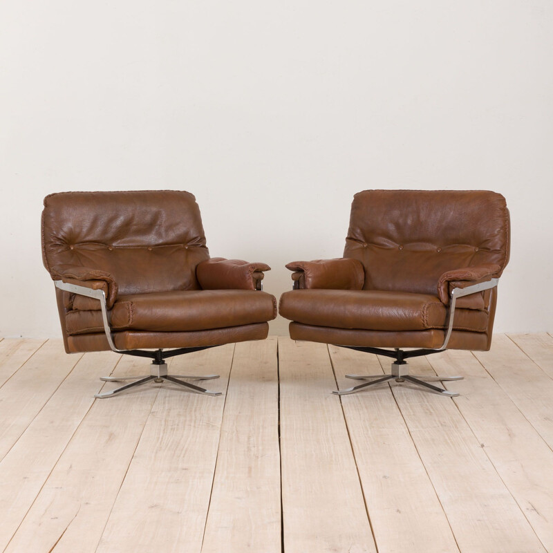 Pair of vintage brown buffalo leather swivel lounge chairs by Aalborg Polstermøbelfabrik Denmark 1970s