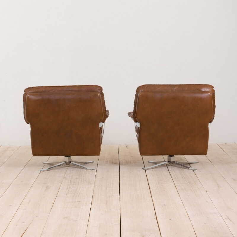 Pair of vintage brown buffalo leather swivel lounge chairs by Aalborg Polstermøbelfabrik Denmark 1970s