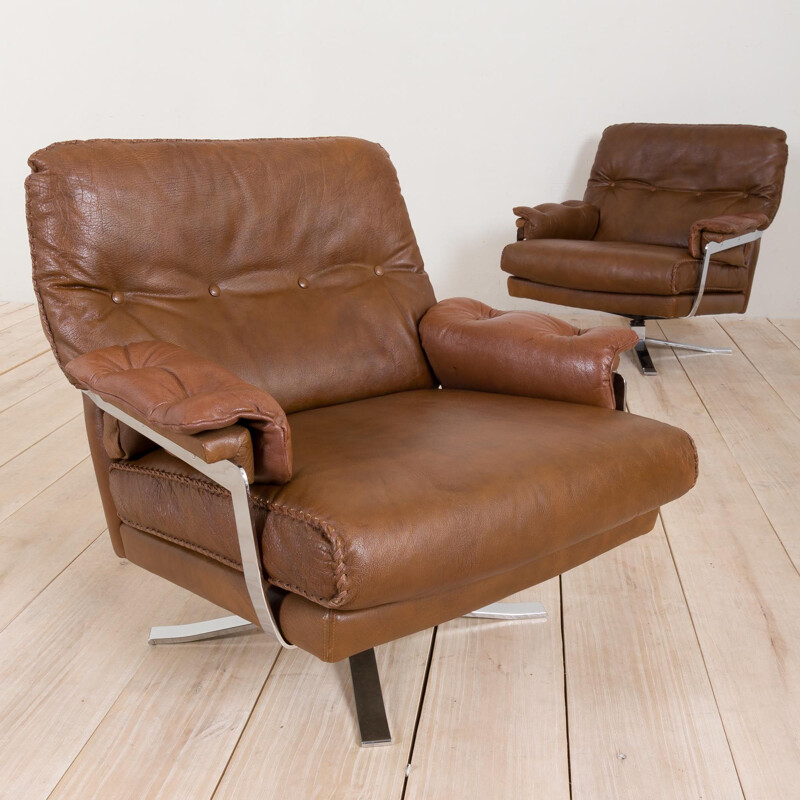 Pair of vintage brown buffalo leather swivel lounge chairs by Aalborg Polstermøbelfabrik Denmark 1970s