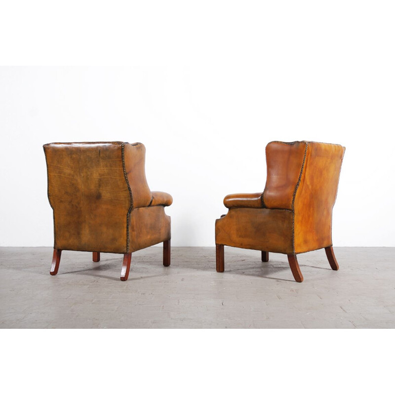 Pair of vintage armchairs with leather ears 1950s