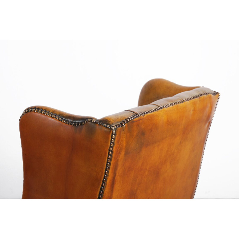 Paire de fauteuils vintage à oreilles en cuir 1950