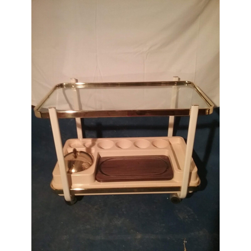 Vintage brass trolley on wheels and ivory lacquered uprights