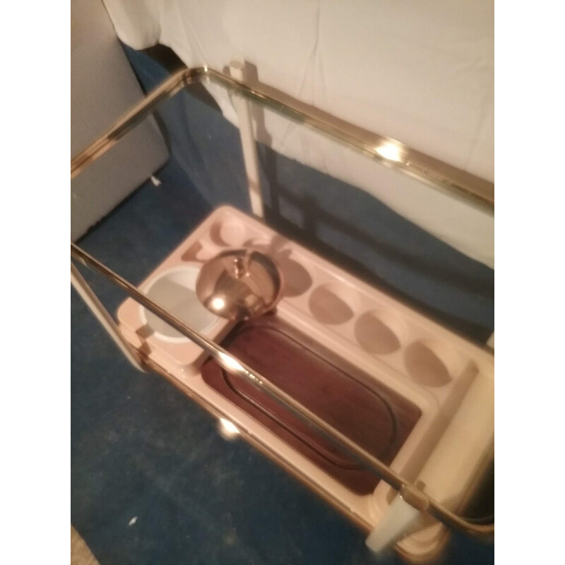 Vintage brass trolley on wheels and ivory lacquered uprights