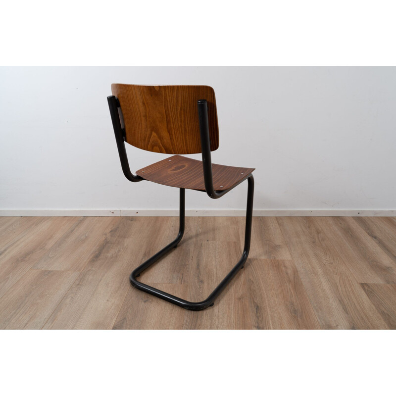 Vintage industrial chair with tubular structure