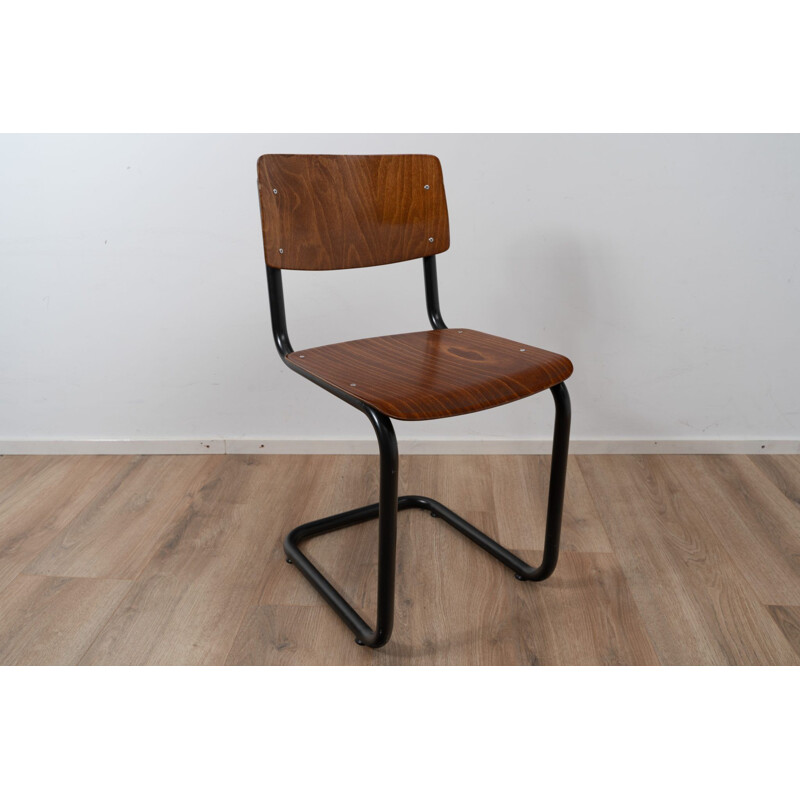 Vintage industrial chair with tubular structure