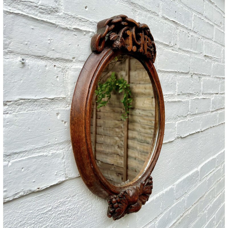 Vintage oval carved wood mirror