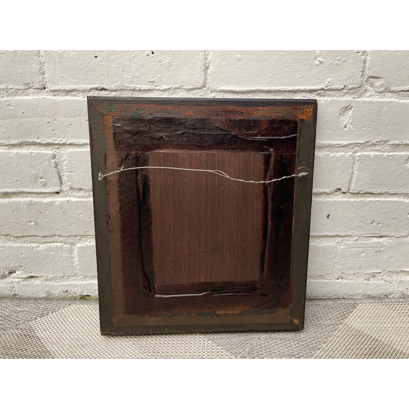 Vintage wall mirror with a thick black wooden frame 