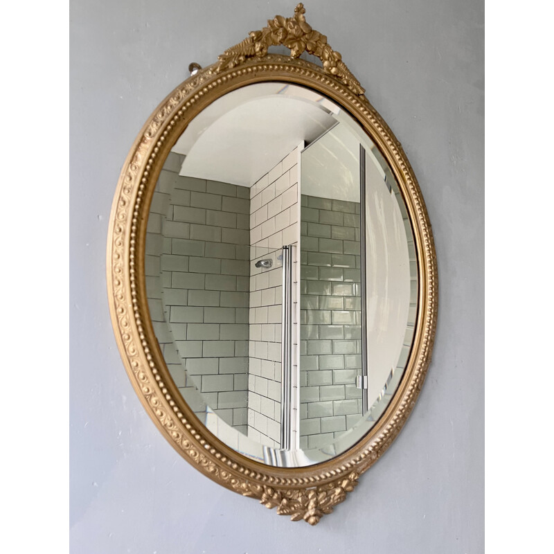 Vintage oval bevelled mirror with gold frame