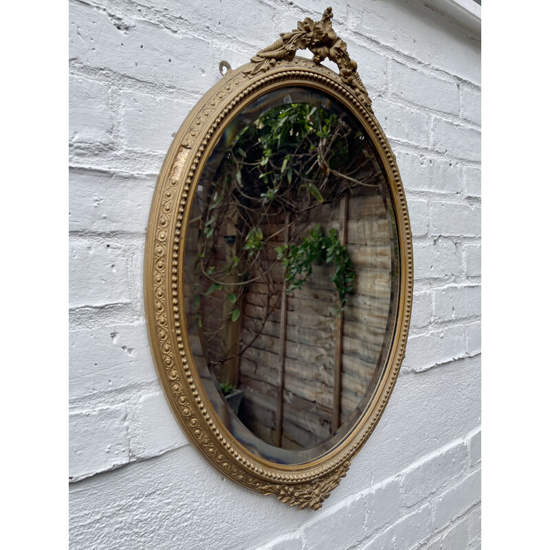 Vintage oval bevelled mirror with gold frame