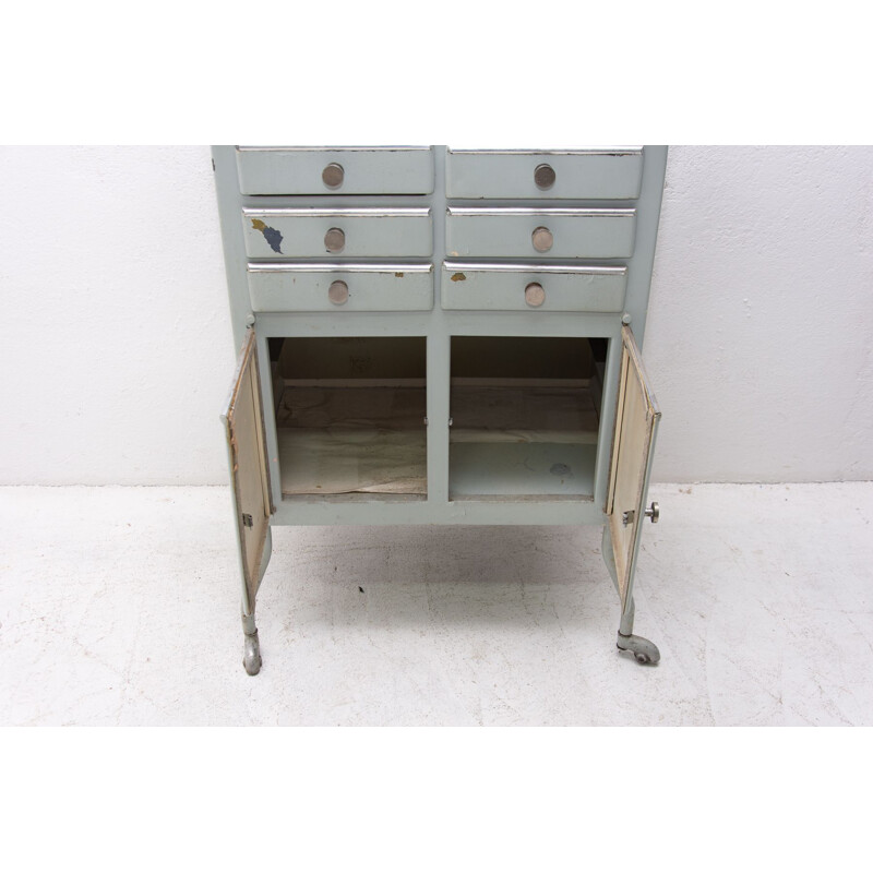 Vintage metal apothecary cabinet on wheels 1960s