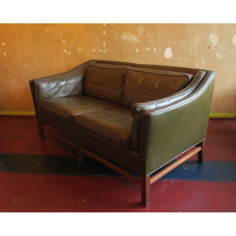 Vintage 2 seater sofa in dark olive green leather and teak frame by Grant, Denmark 1960