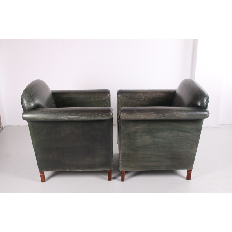 Pair of vintage old green color leather armchairs 1970s