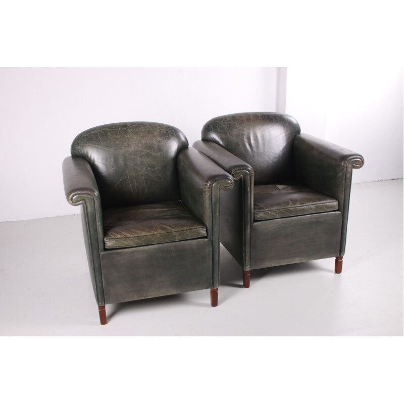 Pair of vintage old green color leather armchairs 1970s