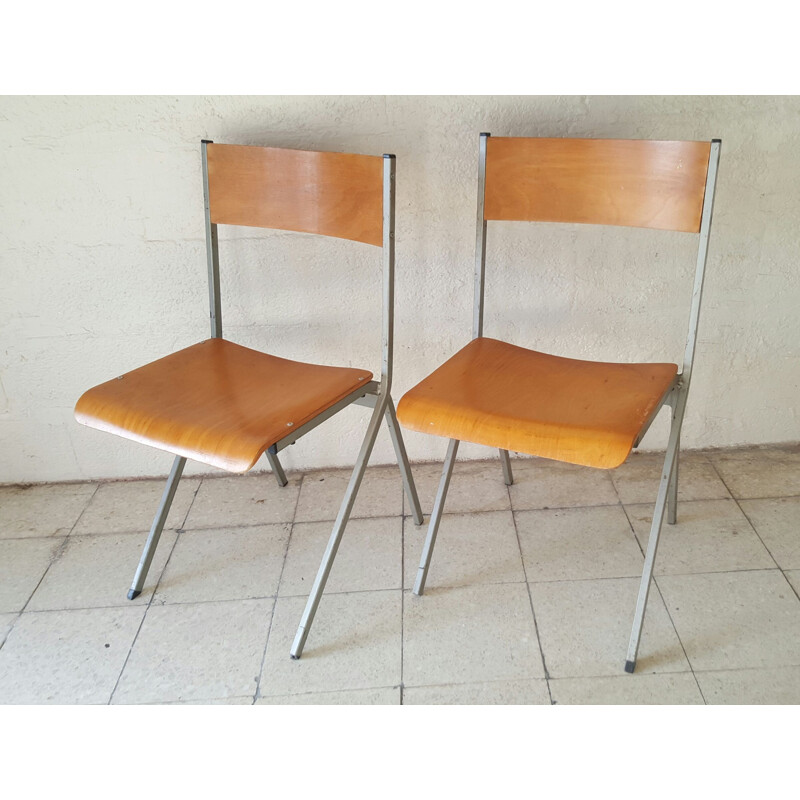 Pair of industrial vintage chairs with metal structure 