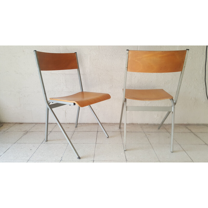 Pair of industrial vintage chairs with metal structure 