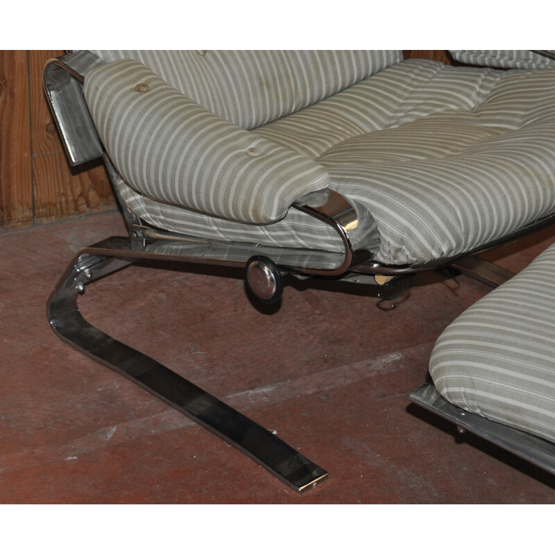 Pair of armchairs in chromed steel with footstools - 1970s