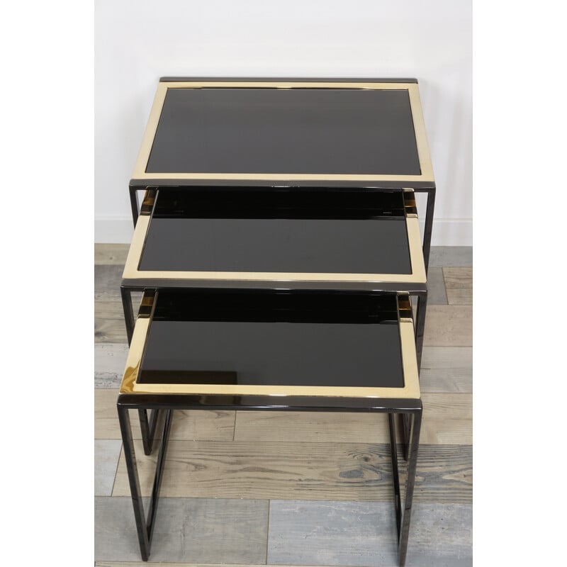 Vintage nesting tables in black lacquered and gold plated metal by Roger Vanhevel 1970s