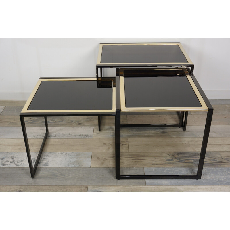 Vintage nesting tables in black lacquered and gold plated metal by Roger Vanhevel 1970s