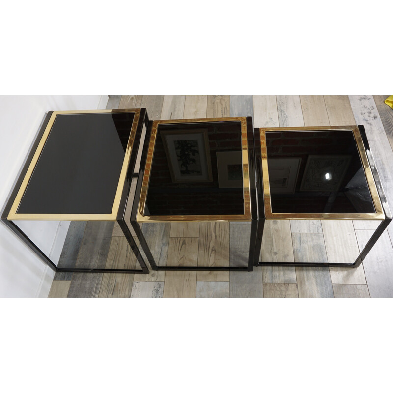 Vintage nesting tables in black lacquered and gold plated metal by Roger Vanhevel 1970s