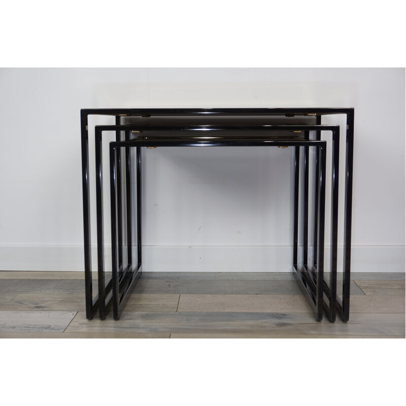 Vintage nesting tables in black lacquered and gold plated metal by Roger Vanhevel 1970s