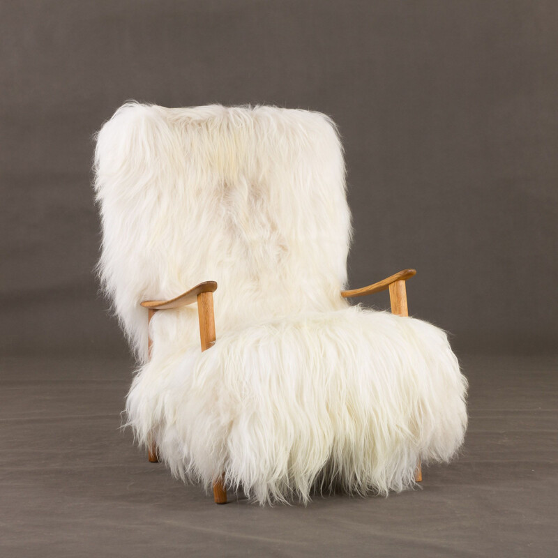 Vintage lounge armchair with high back in very long fur sheepskin, Denmark 1960