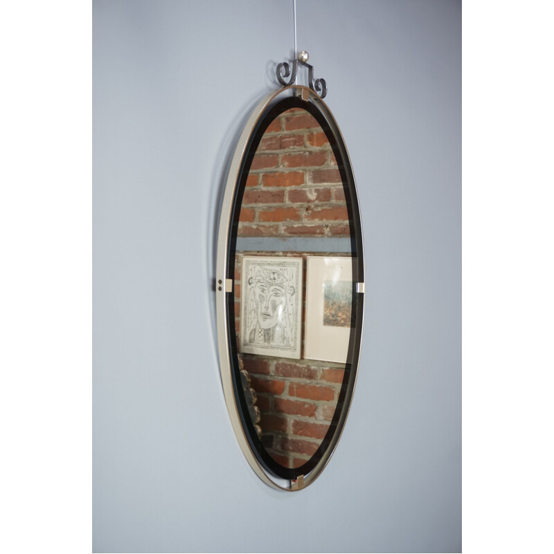 Miroir vintage ovale contour chrome et noir 1950