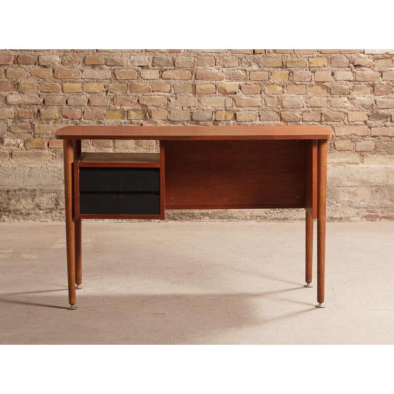 Vintage teak desk with elegant light lines renovated with touches of black 1960s